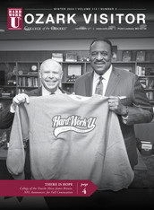 NFL Announcer, James Brown, and Dr. Johnson hold Hardwork U sweatshirt.