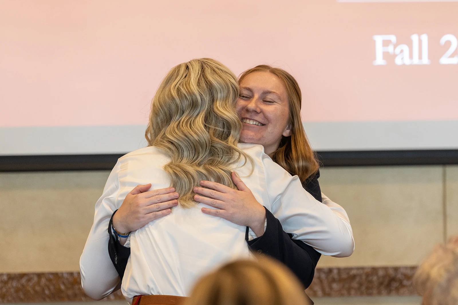 Two ladies hug