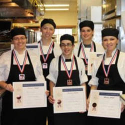 Culinary students holding certificate