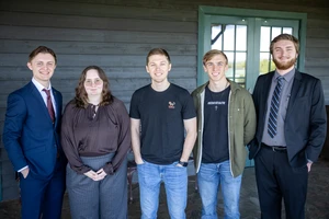 5 people smiling