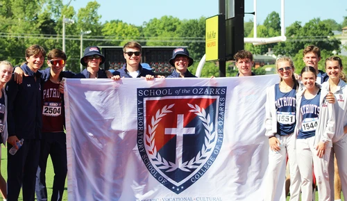 Athletes with banner.