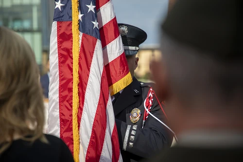 Photo of man holding a flag.