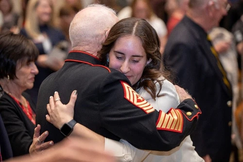 College student hugs Vietnam Veteran 