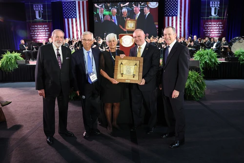 Ken and Barbara Larson gift a 250-year-old Torah Scroll to College of the Ozarks. They unveiled the scroll with President Brad Johnson and C of O Board Chairman Shawn McKenzie during the Spring Forum. 