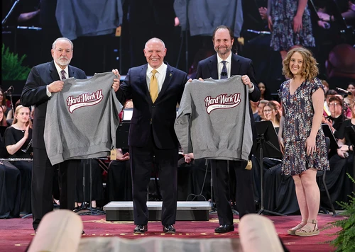 Huckabee and Denison receive a College of the Ozarks sweatshirt, which is traditionally given to speakers at major convocations. They also were presented with unique stained-glass pieces and a variety of student-made products.