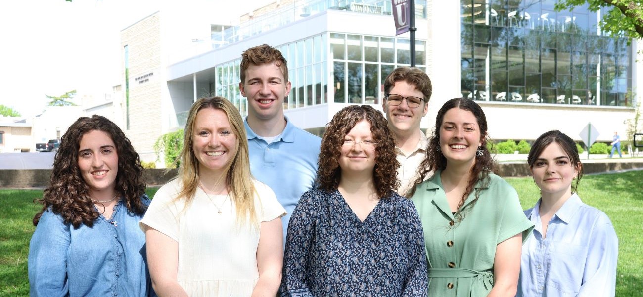 A group of students in front of the student center