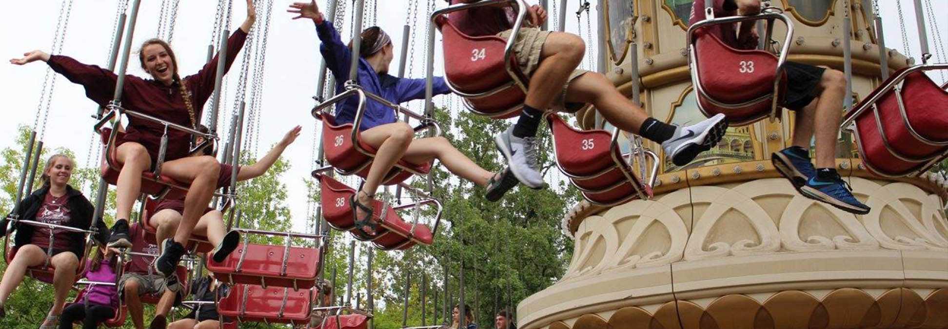 Student on amusement ride