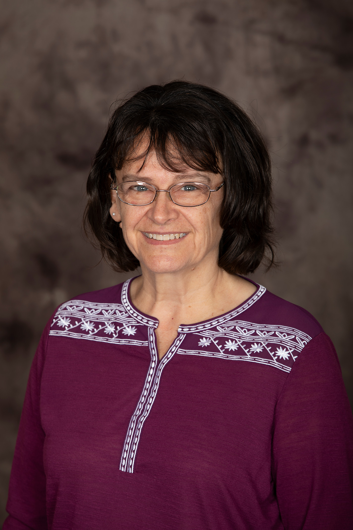 lady in purple blouse