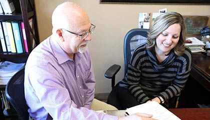 Career Center employees review documents.