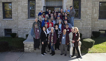 Group of alumni standing on steps