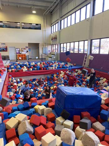 students clean out the foam pit at the Ozark Mountain YMCA