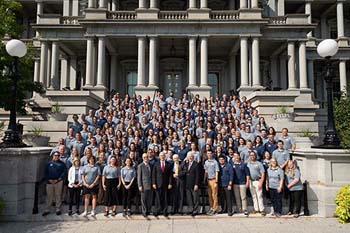 Students with Vice President Pence on steps of Eisenhower Executive Office Building