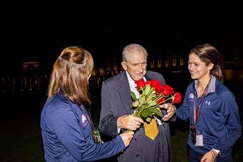 Student present roses to Dr. E. Bruce Heilman