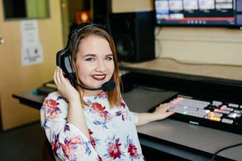 Media student in editing suite.