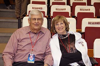 Dr. Howell W. Keeter sitting with his wife in the stands of the Keeter Gymnasium.