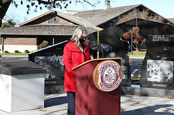Reading of the names at Patriots Park. PICTURED- Dr. Sue Head, vp for cultural affairs and dean of character education