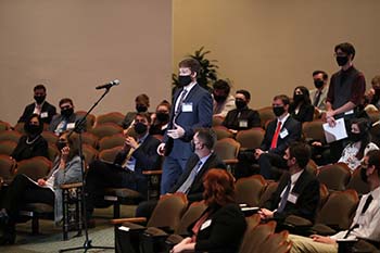 Tanner Maasen, senior computer information science major, asks a question during the 2021 Spring Forum on Free Enterprise.