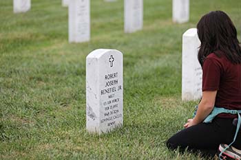 Senior public relations major Hannah Otradovec takes a moment to honor the fallen at Arlington National Cemetery during the second annual CitizenTrip™, sponsored by College of the Ozarks.