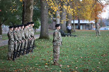 Officer Candidate Drew Vinson leads the Bobcat GOLD teams in a 21-gun salute. (Photo by Shann Swift)