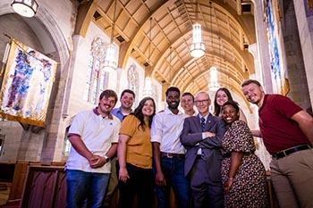 Davis visits with students in Williams Memorial Chapel. Davis has held tightly to the College’s mission and focused on improving operations. The Work College Model, wherein students work to offset the cost of education, remains as the College’s operating system.