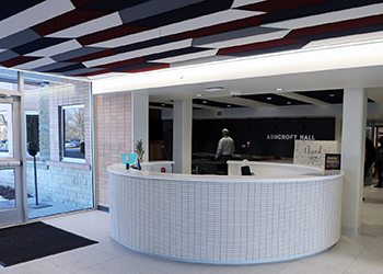 The front lobby of Ashcroft Hall now features a unique ceiling, an open floor plan, and new circular front desk. 