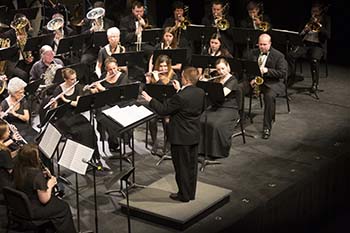 “Members of the Concert Band perform an arranged piece for the spring Concert Band Performance.”