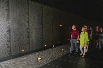 College of the Ozarks President Brad Johnson and his wife, Laura Lacey Johnson, view the Vietnam Memorial at The National Mall.