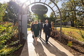 President Brad Johnson, his wife, Laura Lacey, and their children, Evan and Elle, enjoy the Scripture Garden on campus following the prayer service at Williams Memorial Chapel.