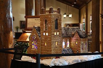 A team of students at The Keeter Center at College of the Ozarks create a gingerbread house modeled after Williams Memorial Chapel, an iconic campus landmark. The Keeter Center will display the model during the Christmas season. 