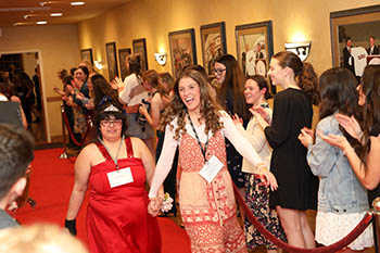Makayla Kramer, senior psychology major, and her guest, Jonel Easterling, walk down the red carpet as College of the Ozarks students cheer them on. The College hosted its annual Night to Shine event, in conjunction with the Tim Tebow Foundation, this evening, Friday, Feb. 10, 2023, in the Silver Dollar City Parlor at The Keeter Center.