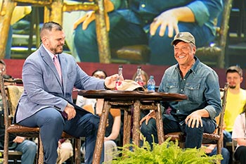 Sharp and Rowe share a laugh while staging the mock talk show during the Spring Work Ethic Forum. 